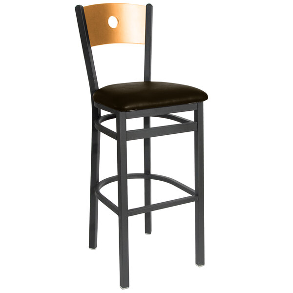 A BFM Seating black metal bar stool with a dark brown cushion and natural wooden back.