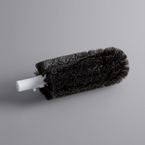 A black round brush with white handle.