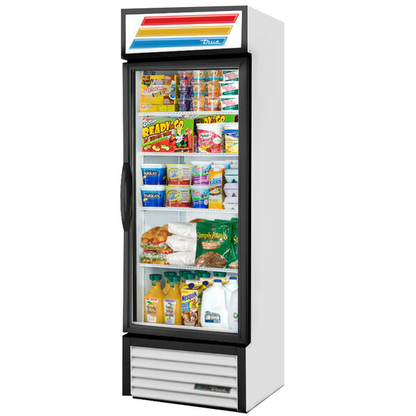 A white True refrigerated glass door merchandiser full of food on the shelves.