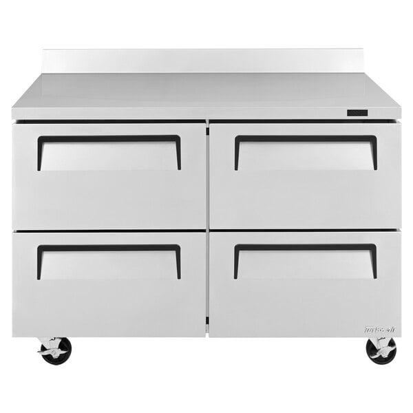 A white cabinet with drawers on wheels.