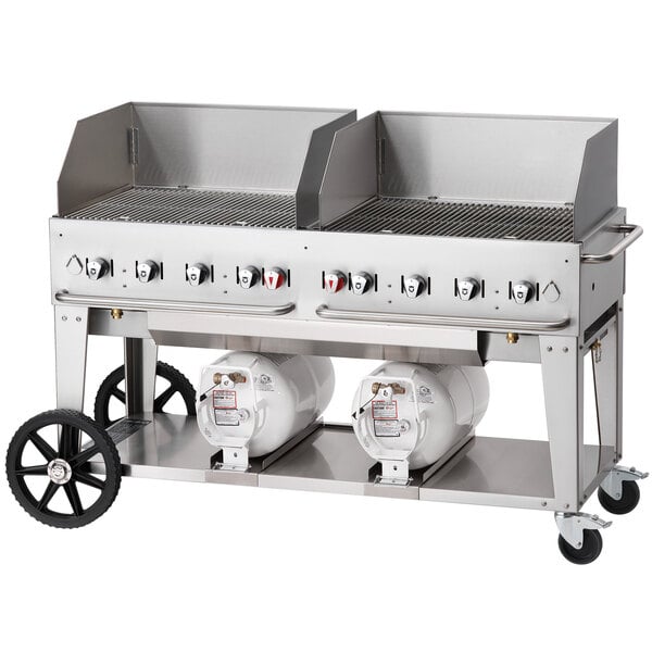 A Crown Verity outdoor club grill on a cart with two white cylinders.