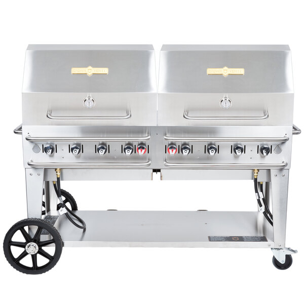 A large stainless steel Crown Verity outdoor grill with wheels.