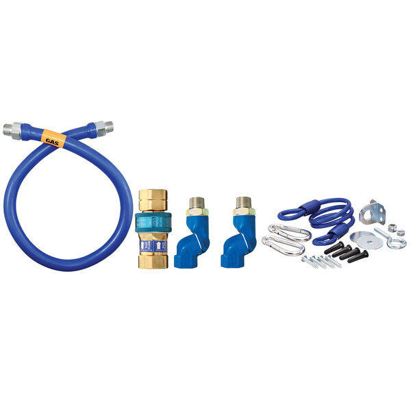 A blue Dormont gas connector kit with hoses and fittings and a silver restraining cable.