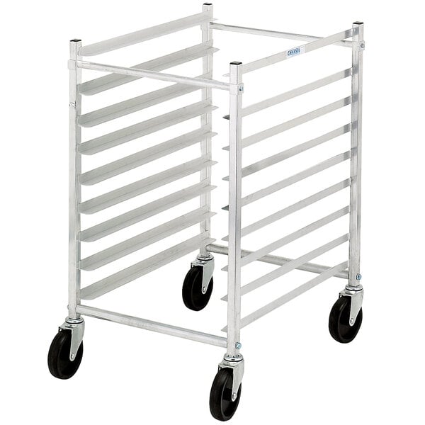 An unassembled aluminum sheet pan rack with black wheels.