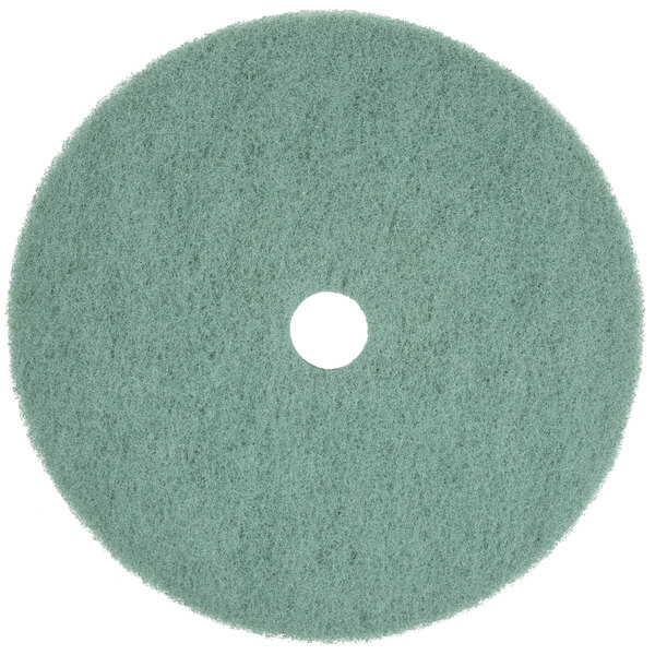 A white and green Scrubble 31" Aqua Burnishing floor pad with a hole in the middle.