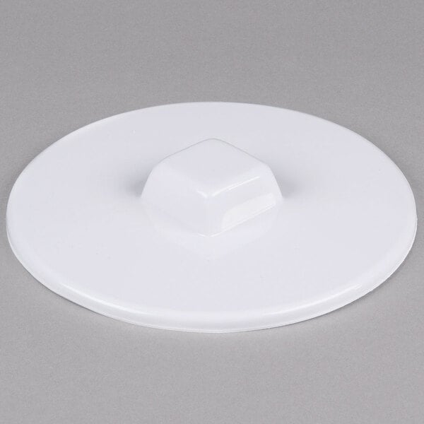 A white square plastic lid for a Master-Bilt commercial ice cream freezer.