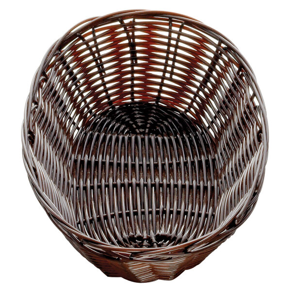 A Tablecraft brown rattan basket with a handle.
