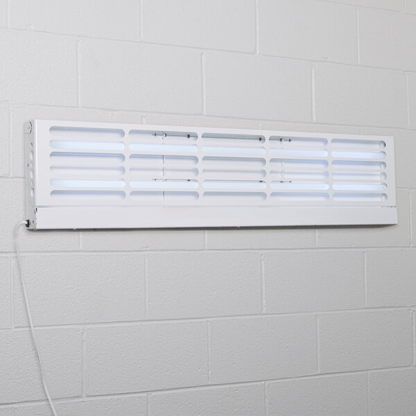 A white rectangular Curtron Pest-Pro flying insect control light with bulbs and a white vent with holes.