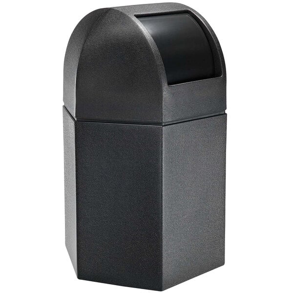 A black hexagonal waste container with a black dome lid.