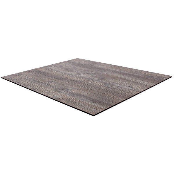A BFM Seating square table top with a driftwood finish.