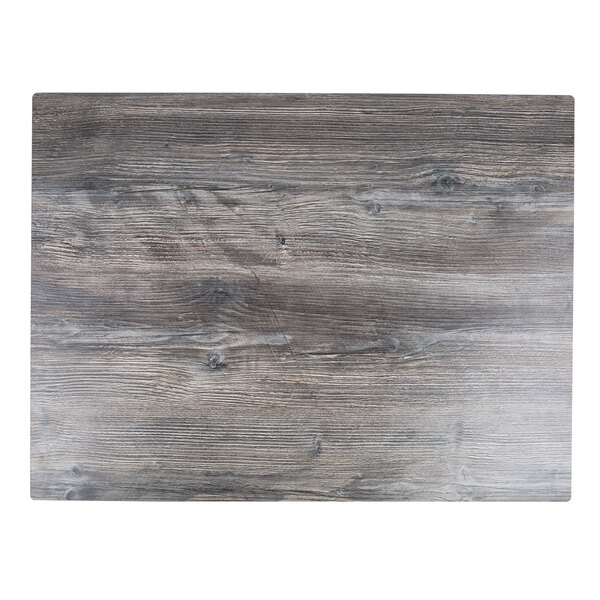 A BFM Seating Tribeca rectangular driftwood composite laminate table top with a wood surface with knots.