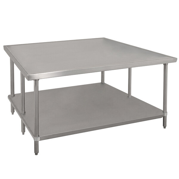 A white rectangular Advance Tabco stainless steel work table with a galvanized undershelf.