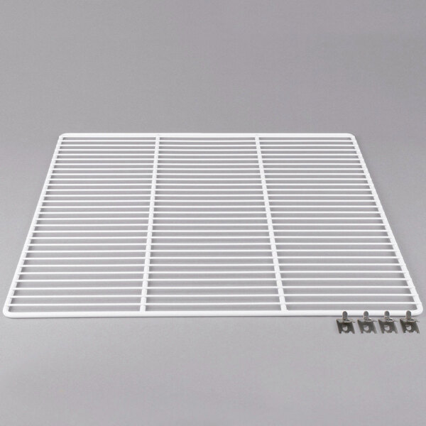 A white powder-coated metal Traulsen shelf grate with metal clips.