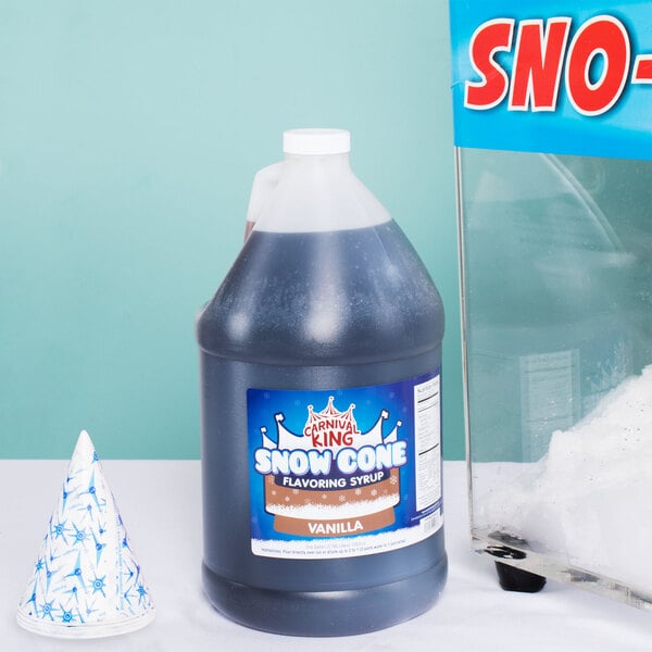 A bottle of Carnival King Vanilla Snow Cone Syrup next to a gallon container.