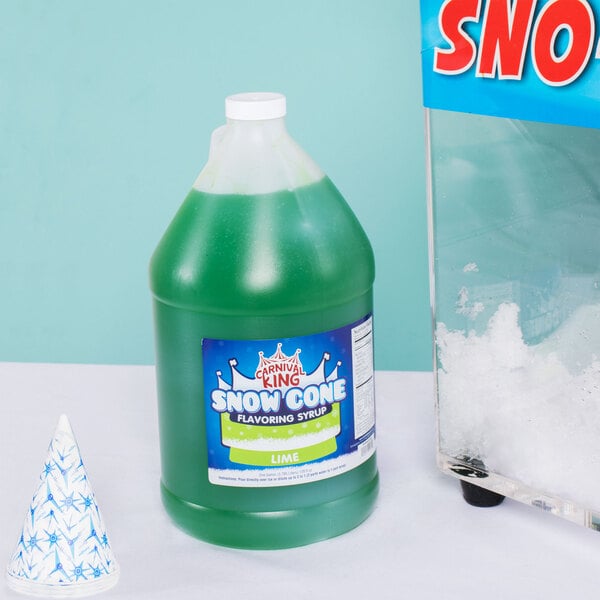 A case of Carnival King lime snow cone syrup in plastic jugs with green liquid.