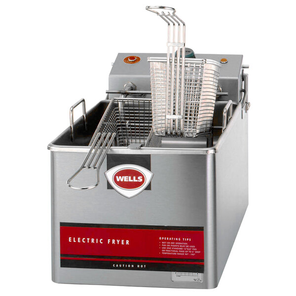 A Wells electric countertop fryer with a basket inside.
