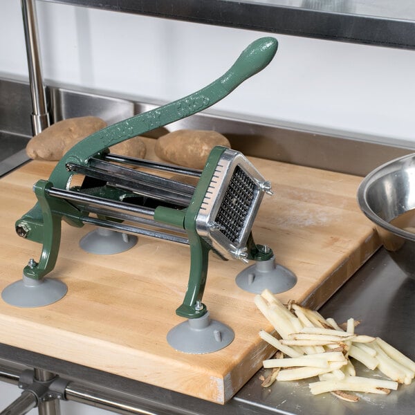 A Choice Prep French Fry Cutter on a cutting board with potatoes.