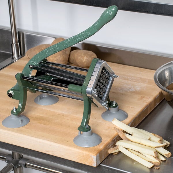 A Choice Prep French Fry Cutter on a cutting board with potatoes.
