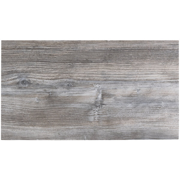 A BFM Seating Midtown rectangular tabletop with a driftwood finish.