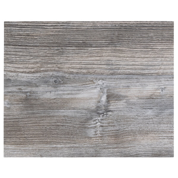 A BFM Seating driftwood table top with a wood texture.