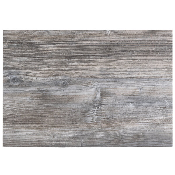 A BFM Seating Midtown rectangular tabletop with a driftwood finish.