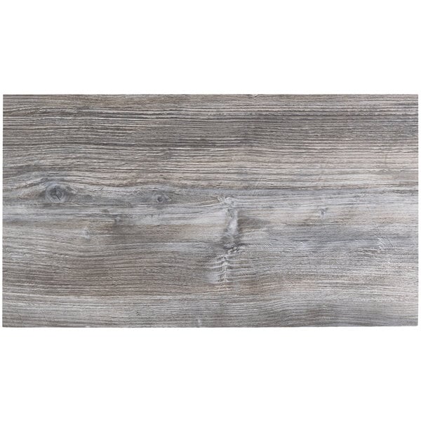 A BFM Seating Midtown rectangular indoor table top with a driftwood finish.