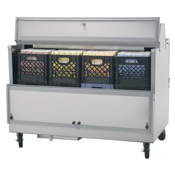 A Beverage-Air stainless steel milk cooler with black crates inside.