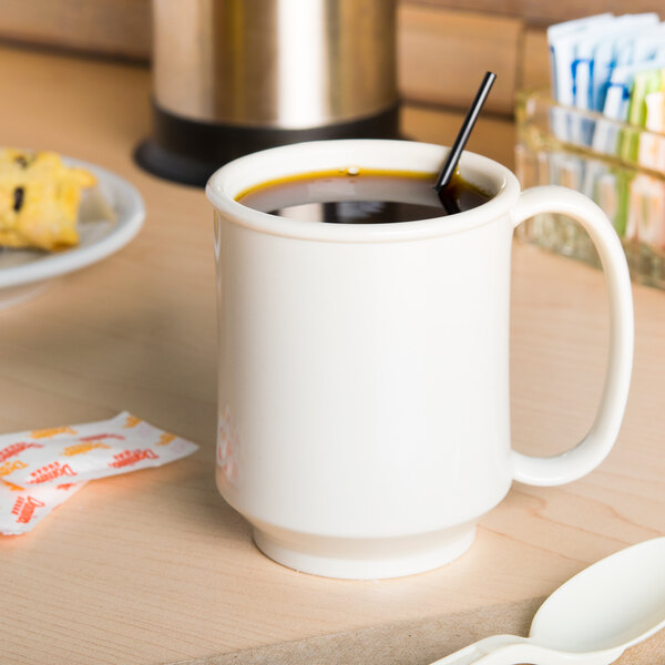 A white GET Tritan mug with a straw in it.