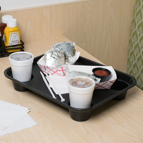 A black GET fast food tray with food and drinks on it.