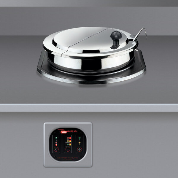 A close-up of a Hatco drop-in round heated food well on a counter.