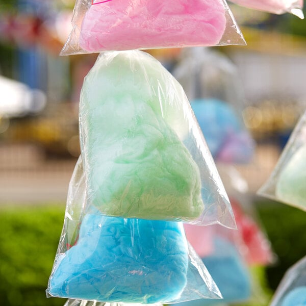 A group of Carnival King cotton candy bags containing cotton candy.