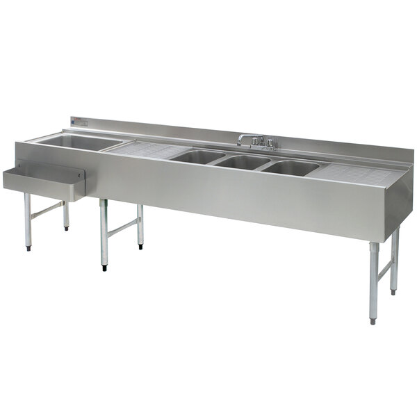 An Eagle Group stainless steel underbar sink with three sinks, two drainboards, and a left side ice bin.