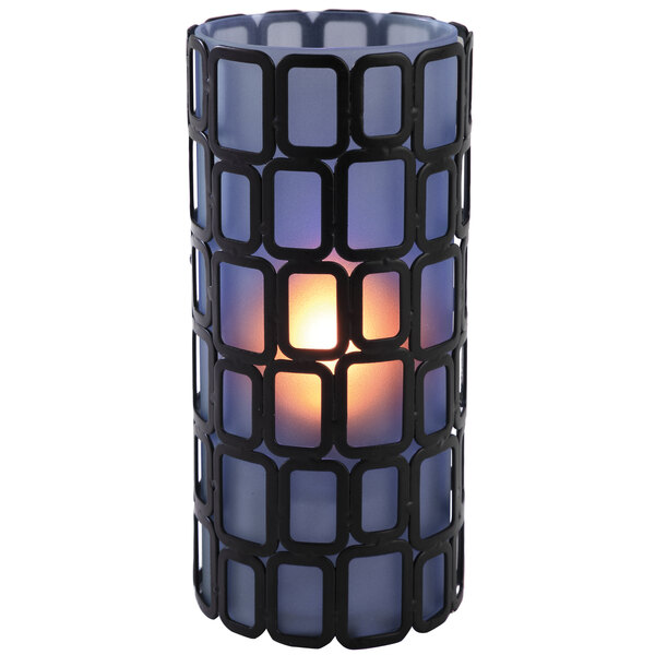A Sterno candle holder with a blue flame inside.