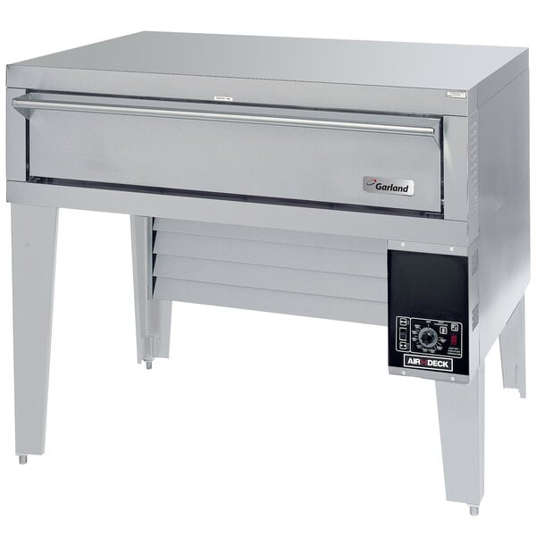 A stainless steel Garland liquid propane pizza deck oven with a bottom-mounted drawer.