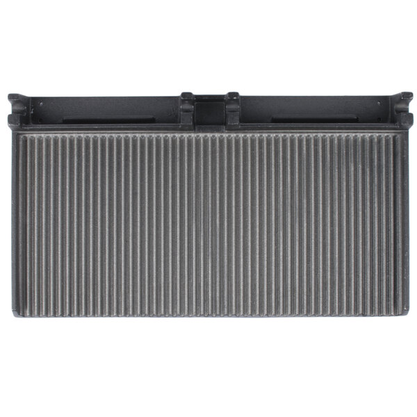 A black and silver rectangular grooved grill plate.