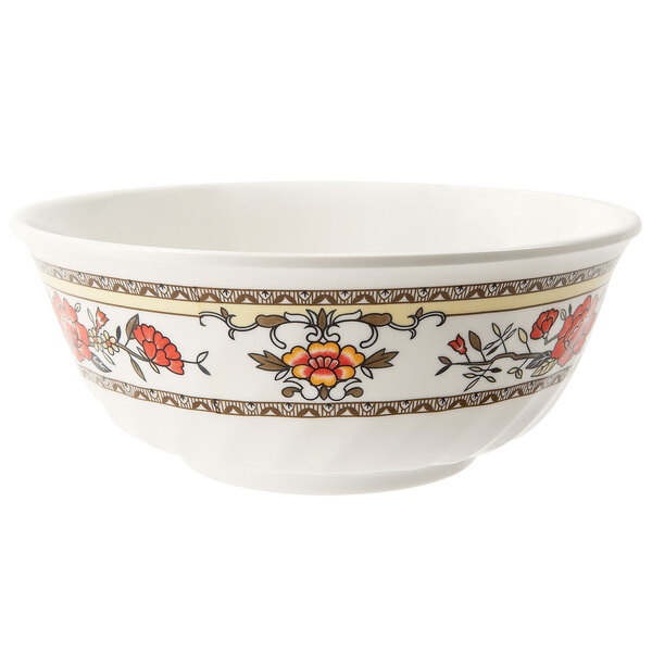A white fluted melamine bowl with a floral design.