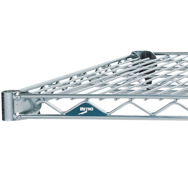 A Metro Super Erecta stainless steel wire shelf with a white label on it.