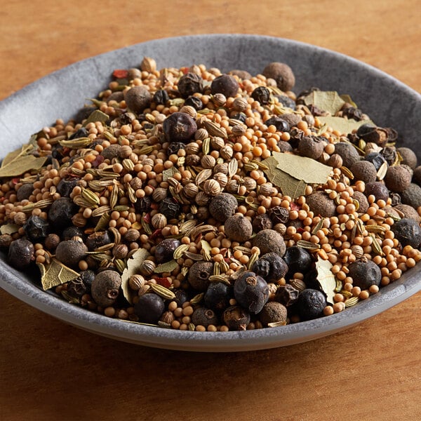 A bowl of Regal Old Fashion Pickling Spice on a table.