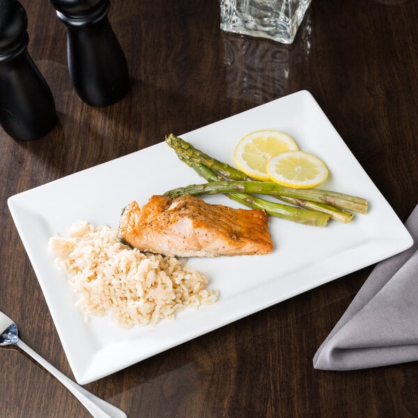 A rectangular Libbey porcelain plate with salmon, rice, and asparagus.