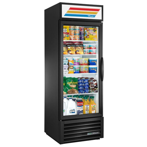 A black True refrigerated glass door merchandiser with food on the shelves.