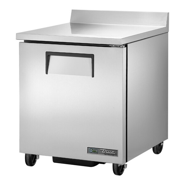 A silver stainless steel True worktop refrigerator with wheels.