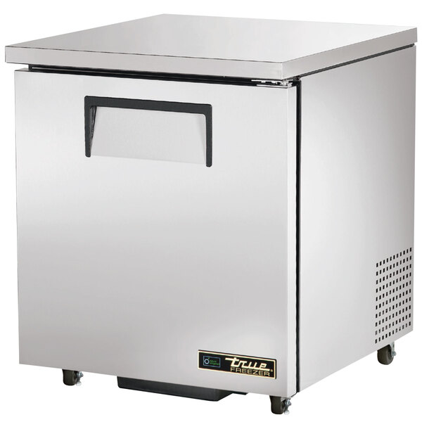 A silver True undercounter freezer with a left-hinged door.