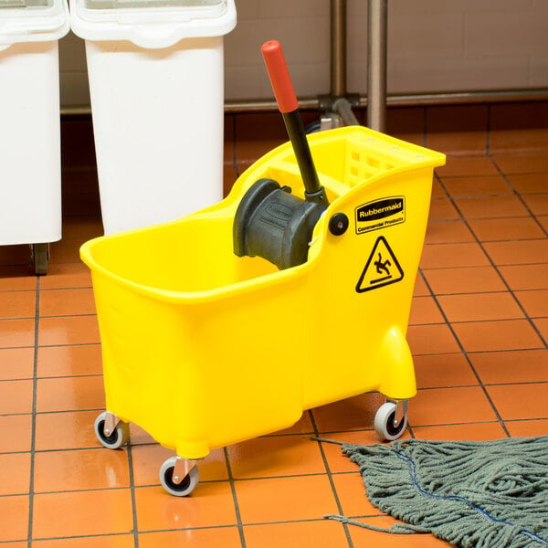 A yellow Rubbermaid mop bucket with a black handle and a red reverse press wringer.