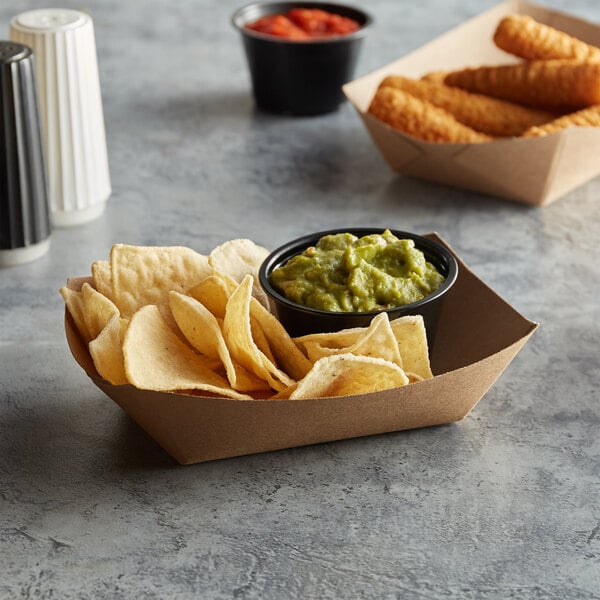 A #200 Natural Eco-Kraft paper food tray with tortilla chips, guacamole, and salsa.