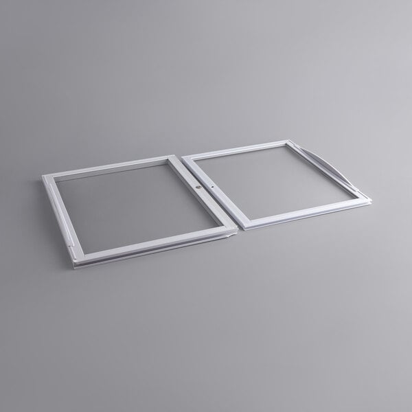 Two white rectangular plastic lids with white borders.