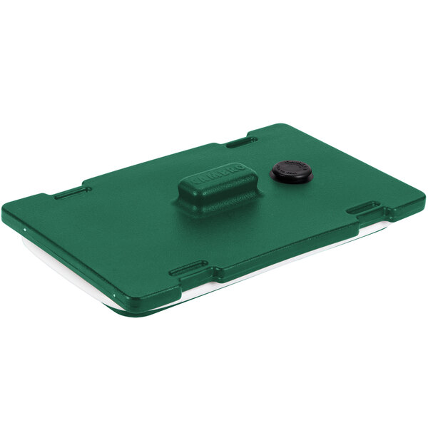 A green rectangular Cambro lid with a black button and text.
