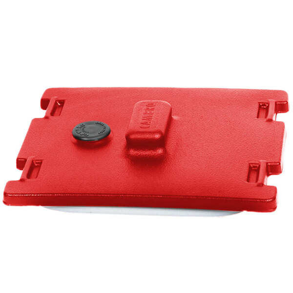 A red rectangular Camtainer lid with a black circle.