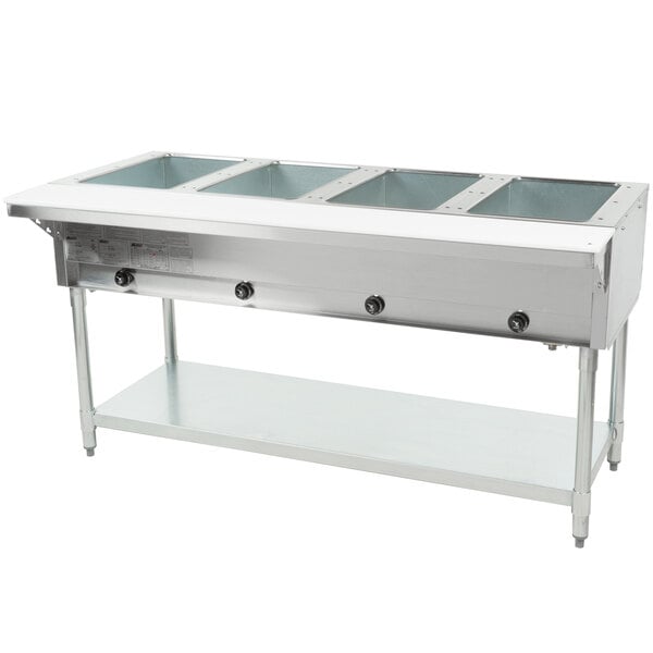 A large stainless steel Eagle Group natural gas steam table with four compartments.