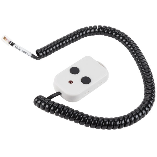 A white rectangular device with black buttons and a white and black cord.