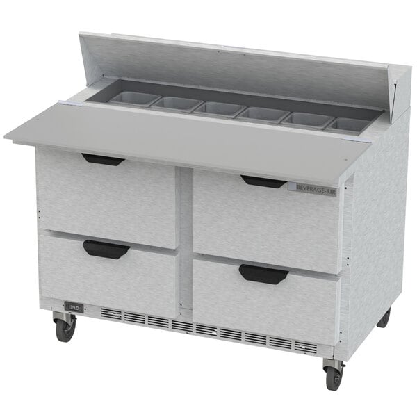 A Beverage-Air commercial refrigerated sandwich prep table with four drawers on wheels.